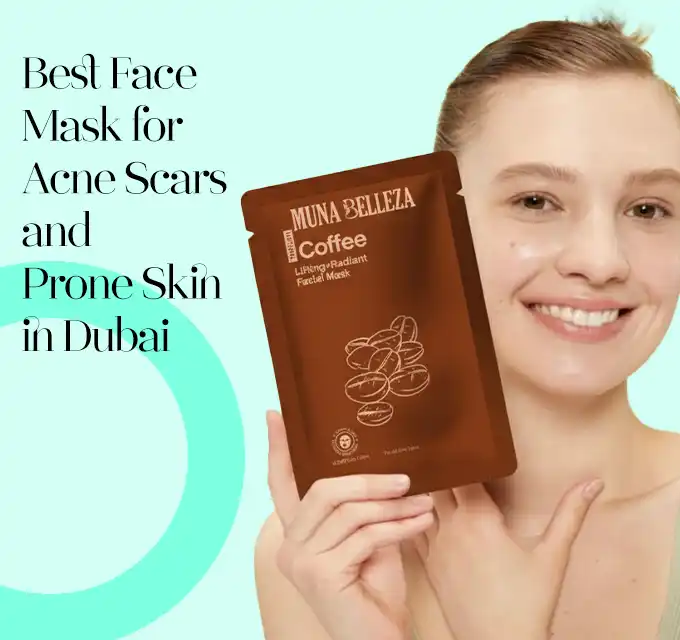 Smiling woman holding a brown coffee face mask sachet up to her chest on a mint background, showing product packaging.