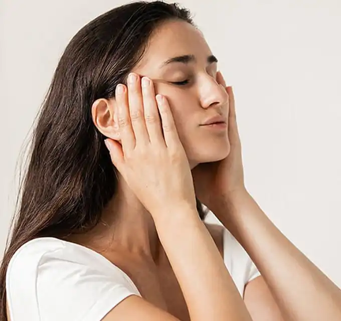 Best moisturizer for pigmentation and pigmented skin. Woman using a moisturizing treatment to reduce pigmentation and improve skin texture.