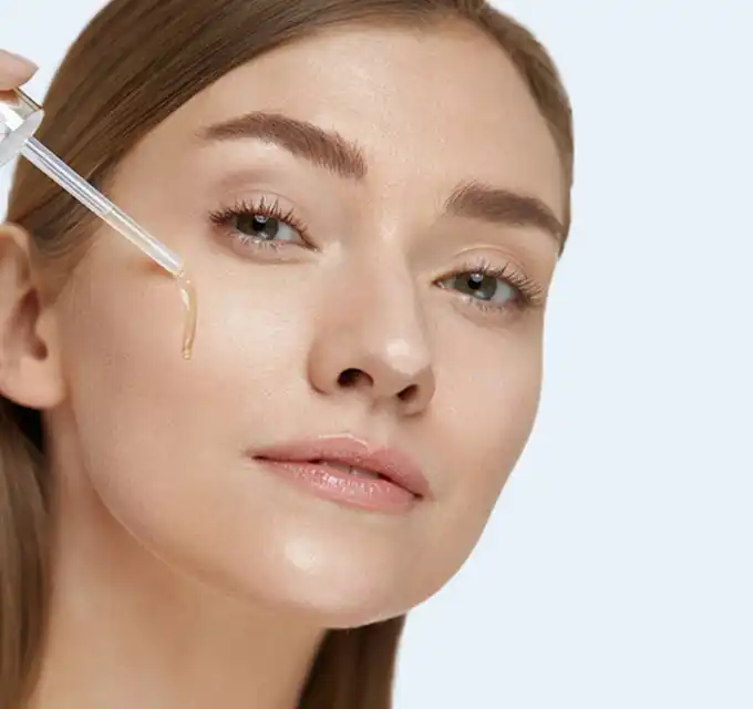 Close-up product shot of collagen serum dropper for face, skincare product highlight