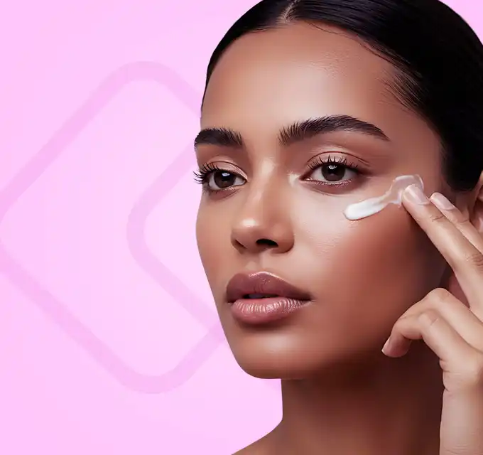 Close-up applying eye product — eye serum vs eye cream for wrinkles comparison