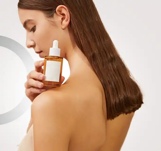 Hydrating vitamin C serum for dry skin with bottle in hand