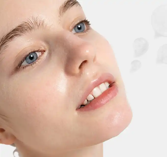 "Close-up of glowing skin illustrating how to apply anti-aging serum for a radiant look."