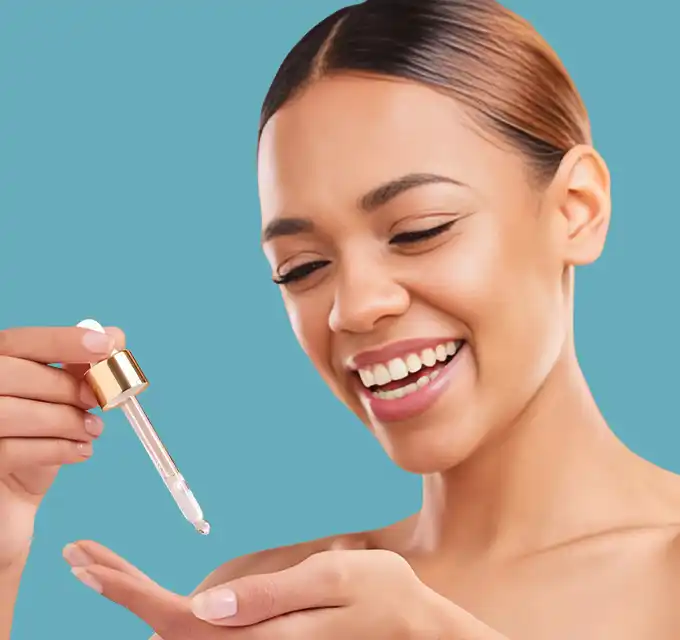 Close‑up profile of a woman applying vitamin C serum with a dropper where to buy serum for face, highlighting dermatologist‑recommended, affordable and high‑performance vitamin C serums